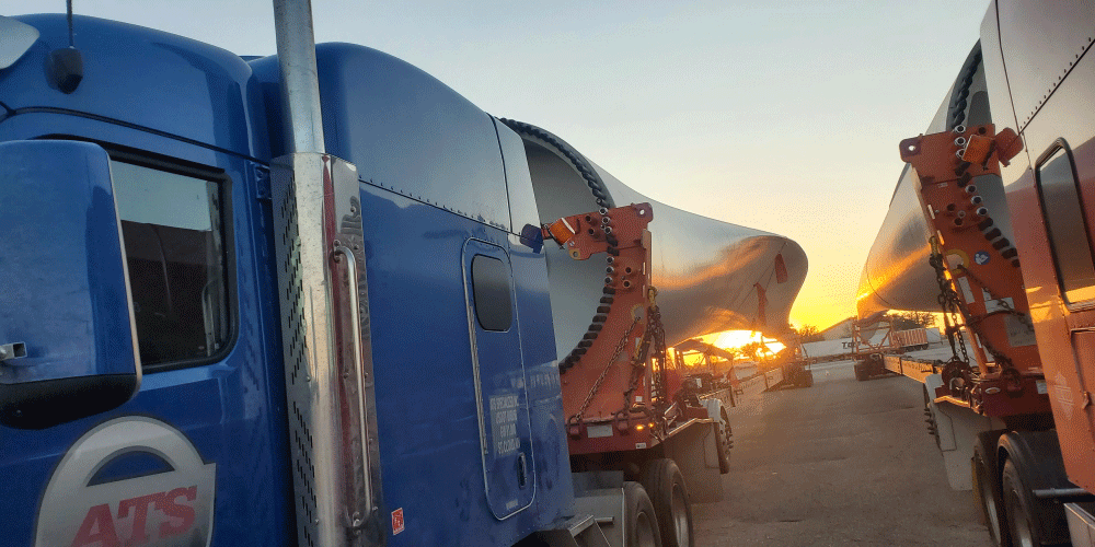 Two ATS trucks hauling blades.