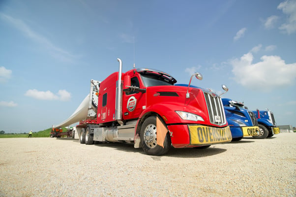 ATS semi-truck fleet loaded with wind turbine blades