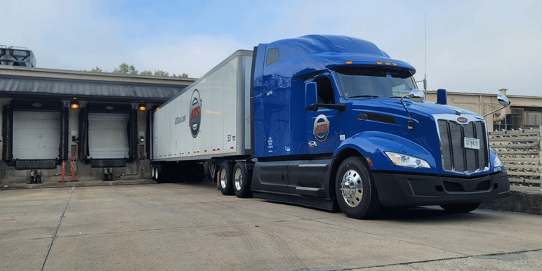 ATS dry van truck backs into dock