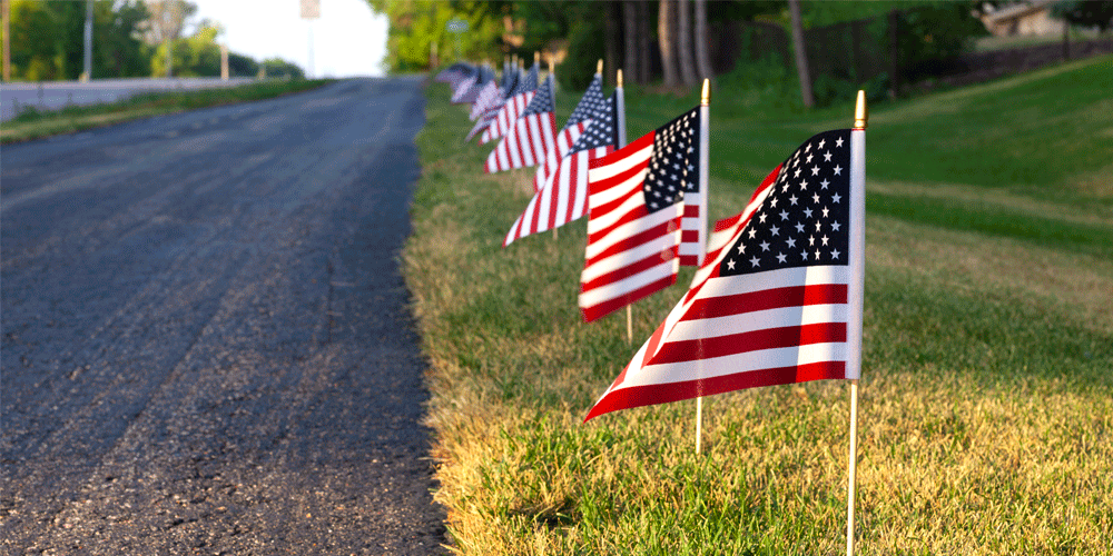 American flags on the side of the road