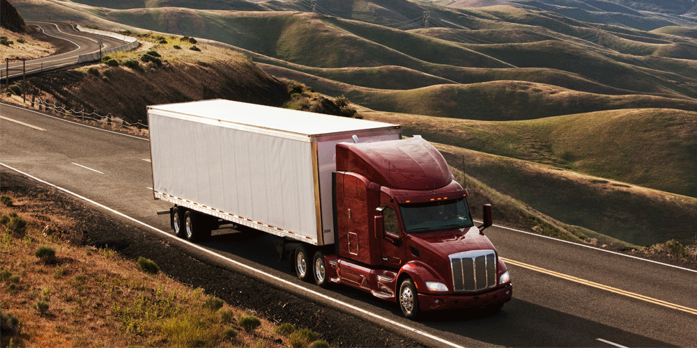 Commercial truck driving through farmlands