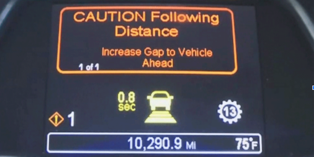 Peterbilt digital dashboard showing an alert that says "CAUTION Following Distance. Increase Gap to Vehicle Ahead."