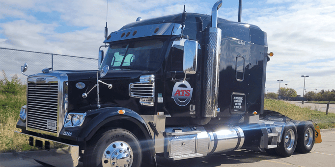 Black ATS semi-truck tractor parked in a lot without a trailer attached, Anderson Trucking Service, truck lease-purchase