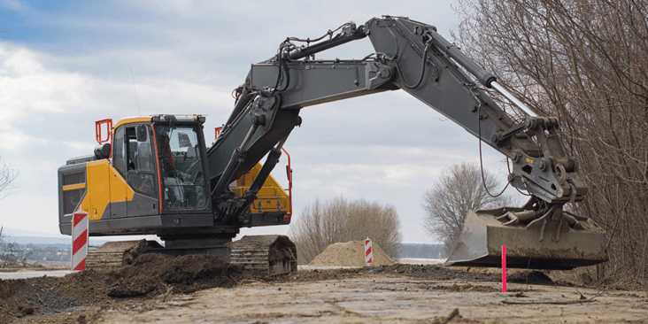 Digger on the side of a road.