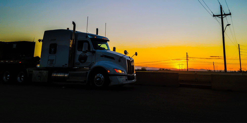 Trailer silhouetted in a sunset. 