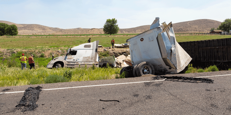 Smashed semi-truck on side of the road, DOT accidents
