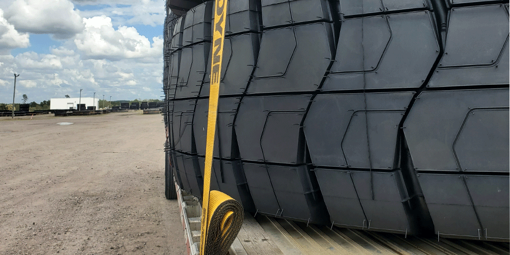 Close up view of tires secured on a trailer.