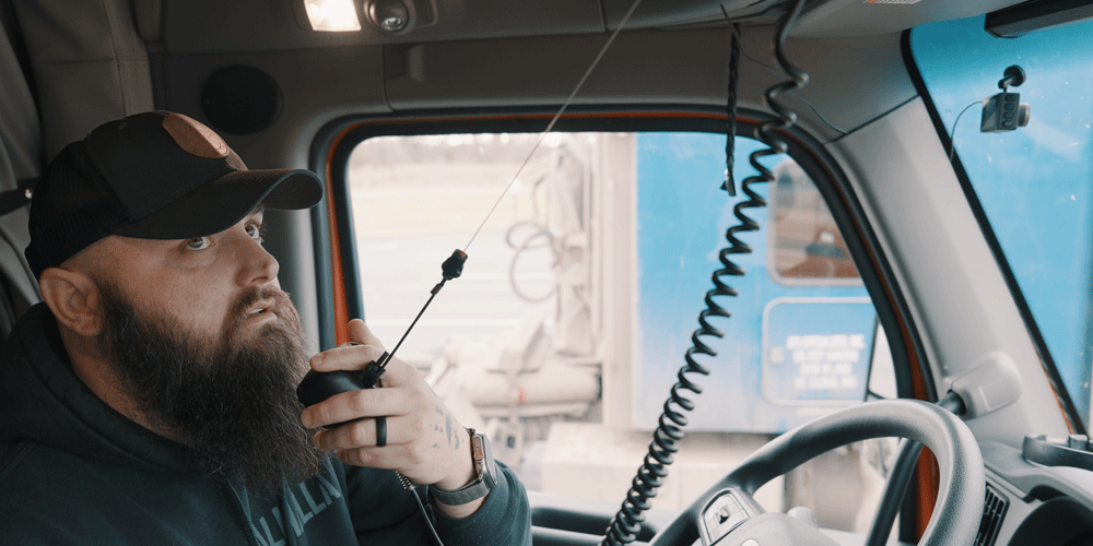 Truck driver talking on CB radio.
