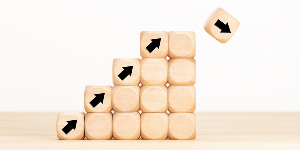 Stack of tan blocks with black arrows pointing upward.