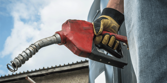 Driver holding a gas pump
