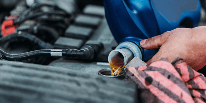 Close up of a truck in the shop getting an oil change