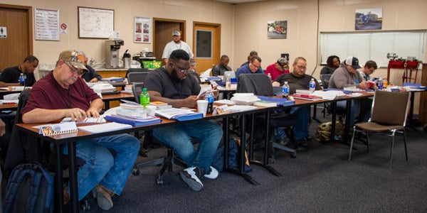 A busy truck driving training classroom