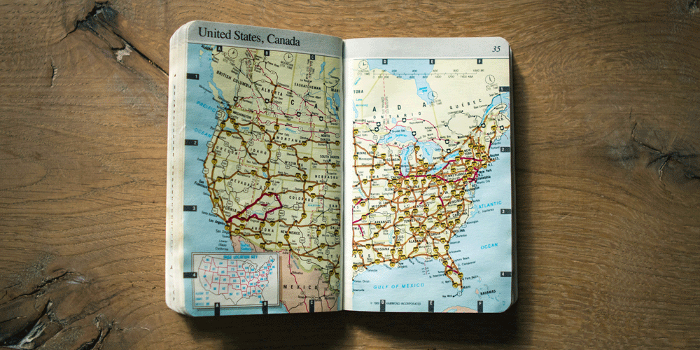 Map laying onthe table The booklet is opened to the page with the map of the United States.