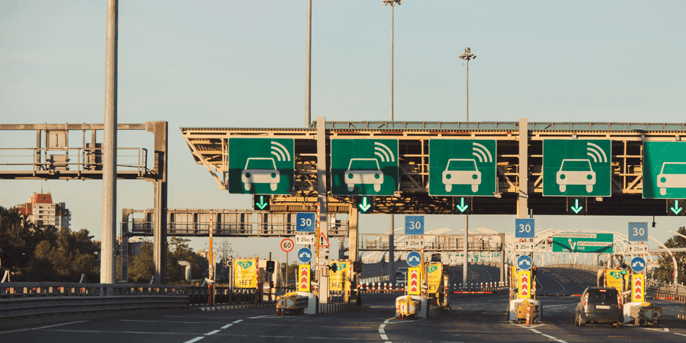 Toll booth with several open lanes.