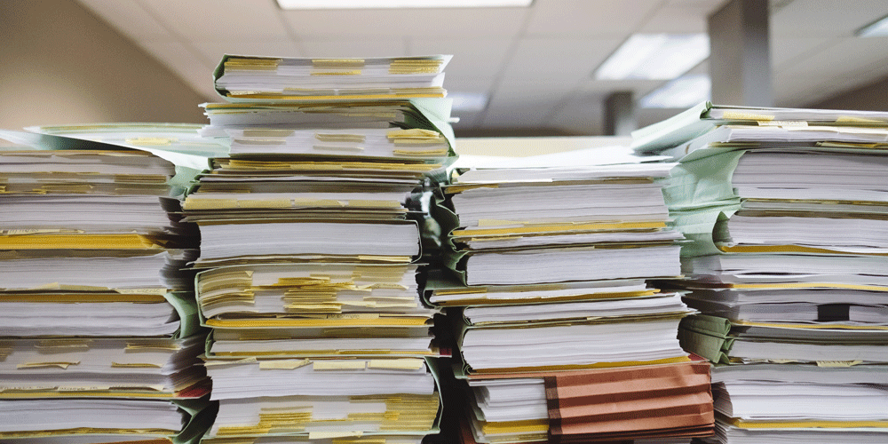 Four huge stacks of paperwork.