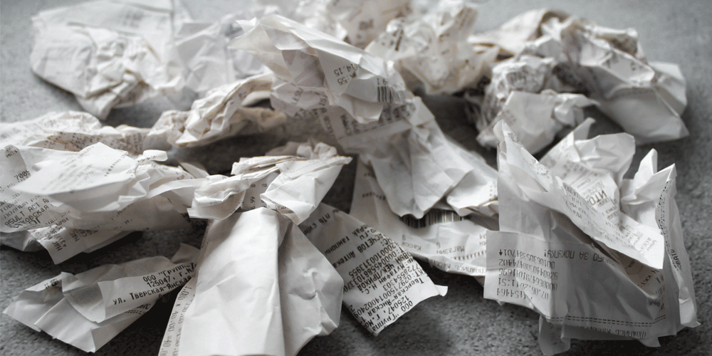Pile of crumpled receipts.