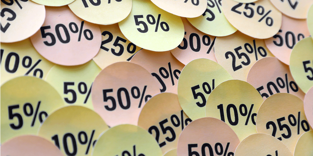 Round stickers with different percentages on them.