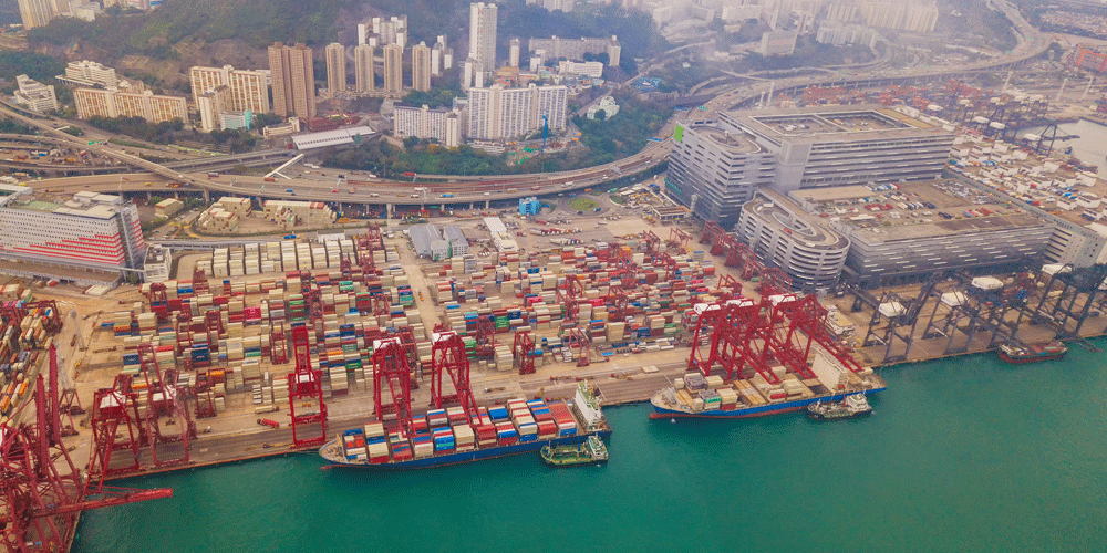 Sky view looking down at a port full of containers.