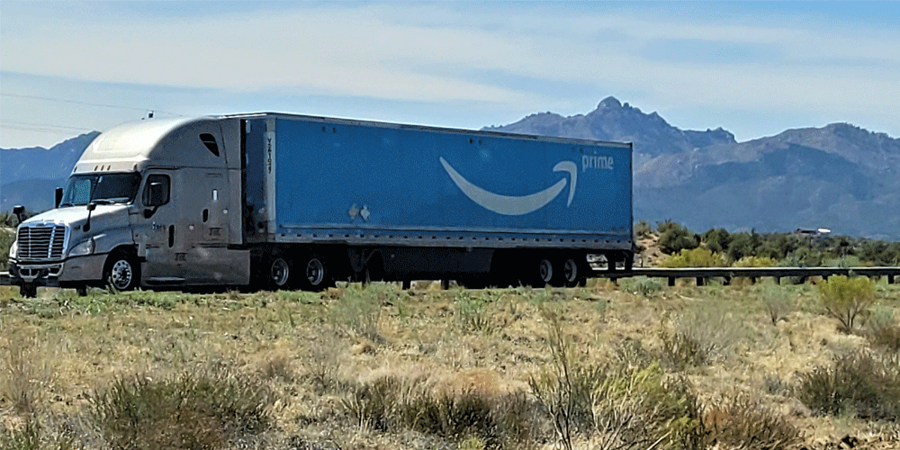 Amazon Prime truck driving through the mountains.