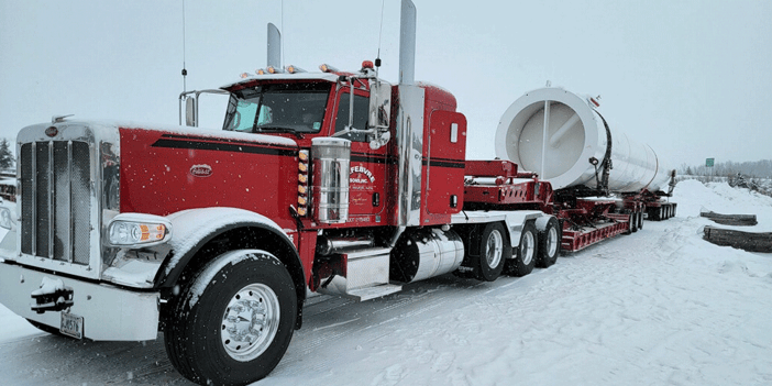 Red Peterbilt truck parked in the snow, how to end a trucking contract, Anderson Trucking Service, independent contractor, trucking
