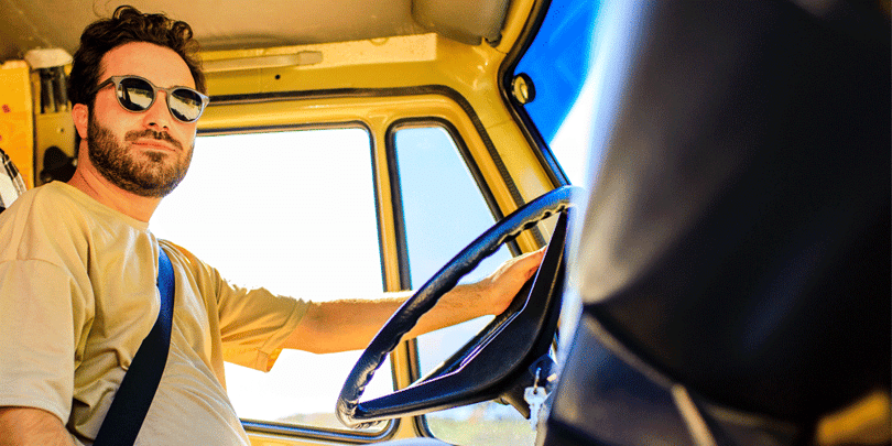 Truck driver behind the wheel of his truck