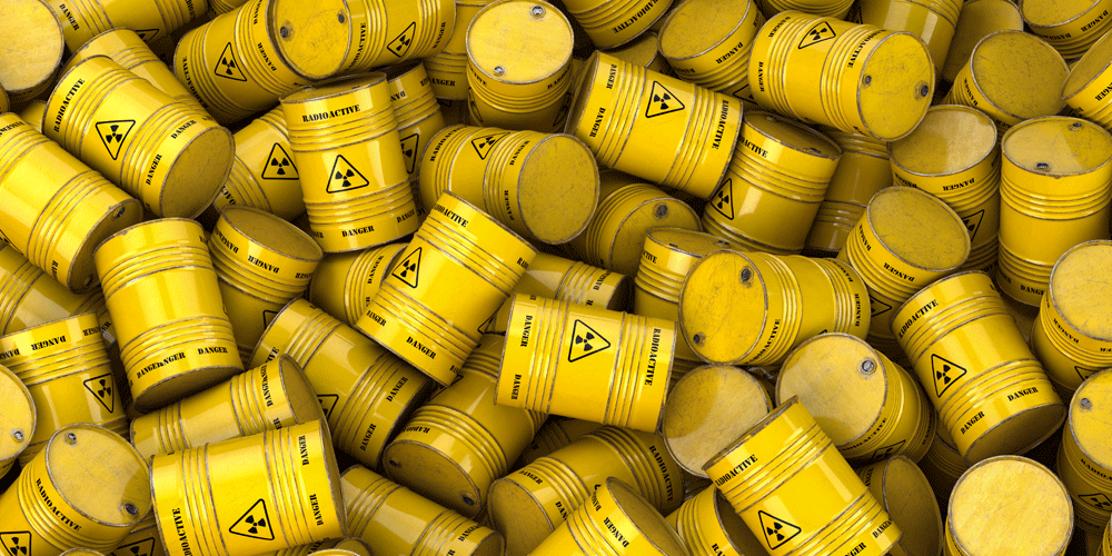 Yellow barrels with the yellow hazardous materials symbol.