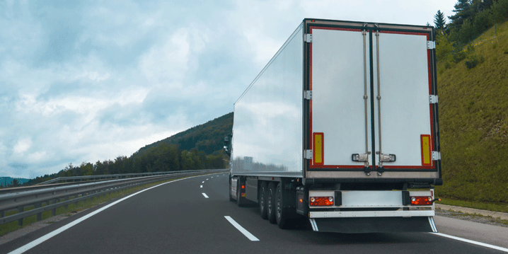 Semi with dry van driving on a two lane road, how to navigate headhaul and backhaul freight markets