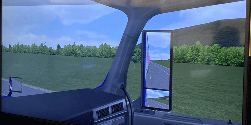 Image of what a truck simulator screen looks like. It shows the side view of the simulator.