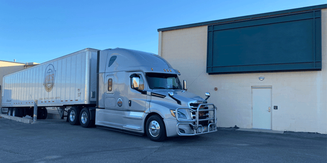 ATS dry van truck backed up to a loading dock, weight distribution on a van trailer, reefer, Anderson Trucking Service