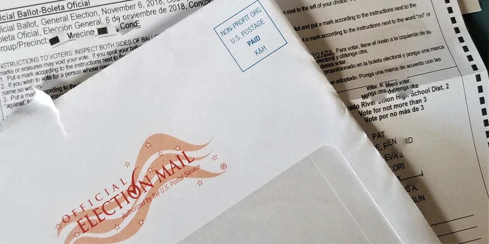 Mail-in ballot and envelope to mail it in.