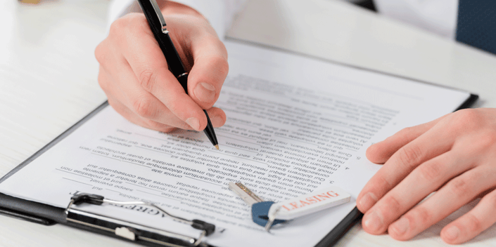 Person looking over a lease contract
