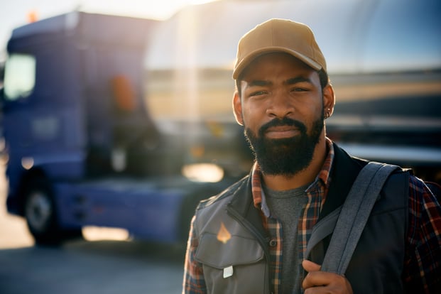 black-professional-driver-on-truck-parking-lot-loo-2026-03-17-00-32-07-utc