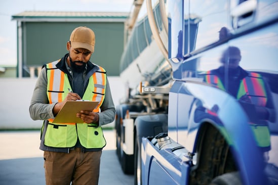 black-truck-dispatcher-checking-shipment-list-on-a-2026-03-16-03-29-48-utc. 2026 mid-year trucking industry update for drivers