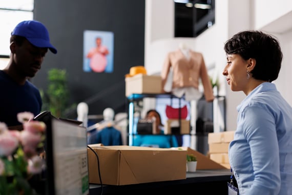 retail-worker-helping-customer-at-checkout-counter-2026-03-19-02-00-34-utc. 2026 mid-year trucking update for drivers.
