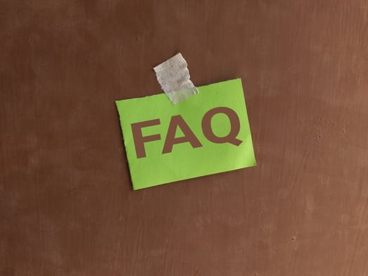Sheet of paper with the letters "FAQ" taped onto a door. The best heavy haul trucking companies in 2026.